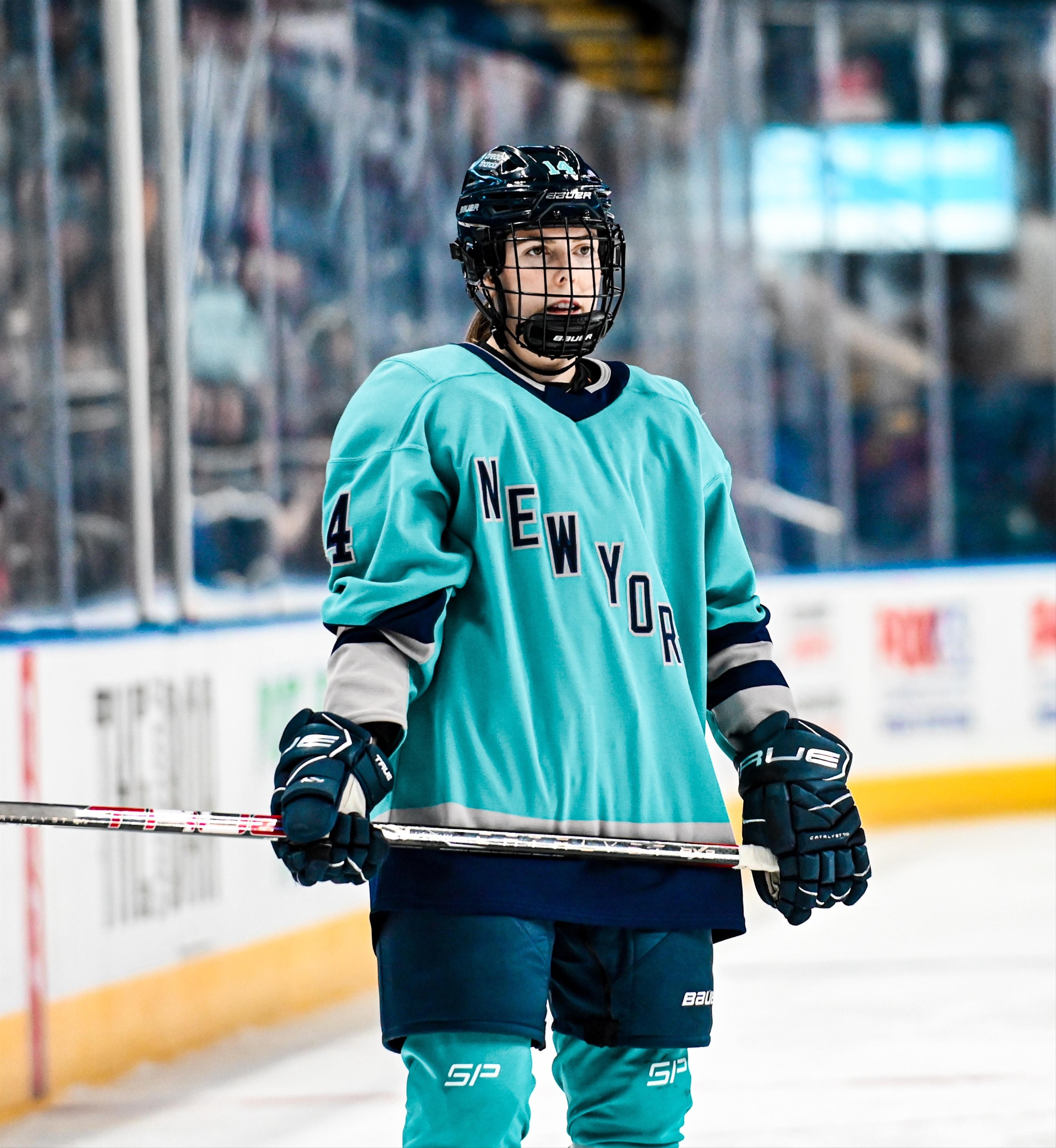 Jaime Bourbonnais attentively eyeing the play in her PWHL New York jersey