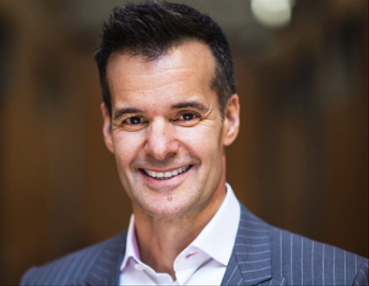 A headshot of Lino Saputo Jr. smiling