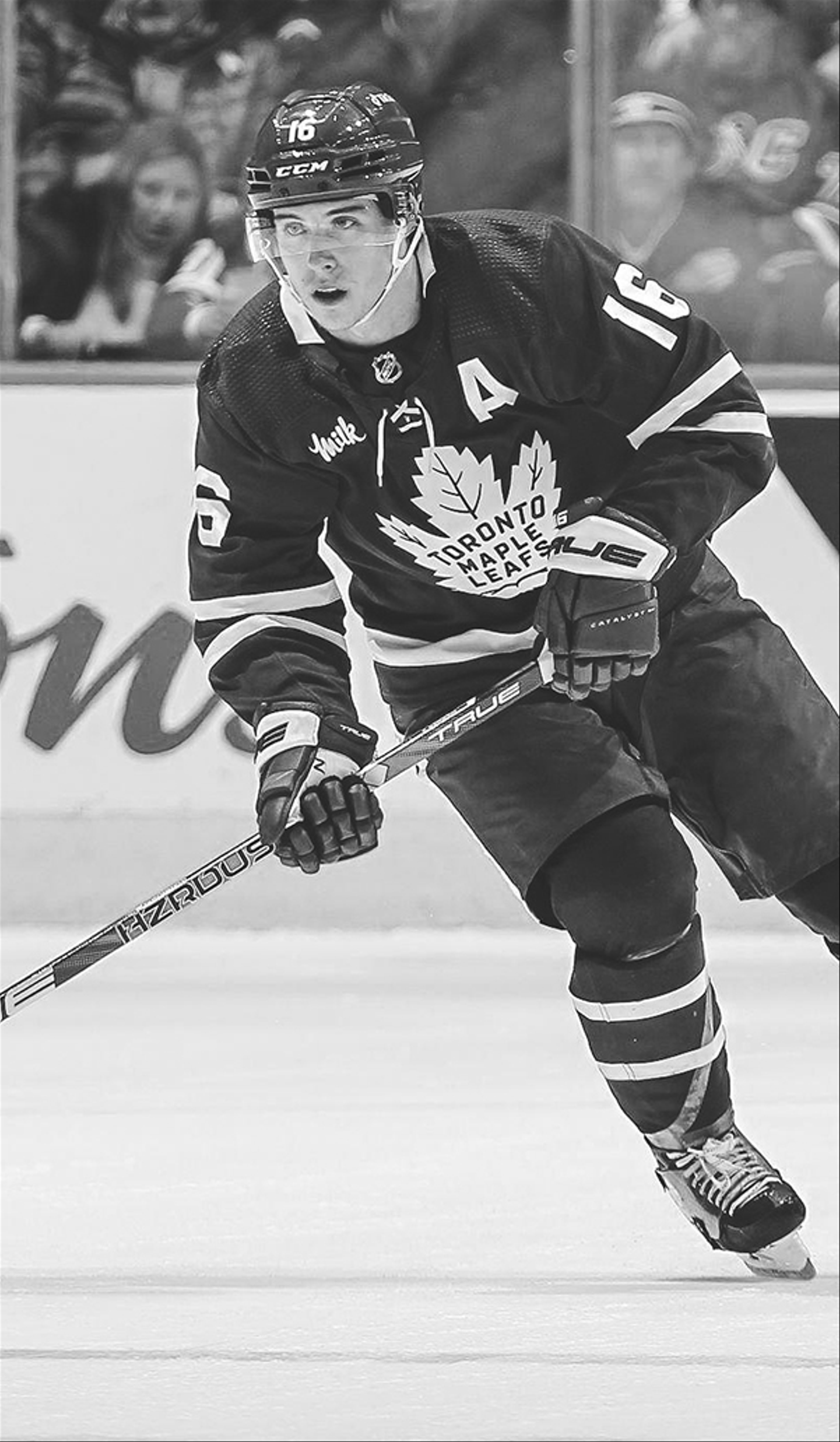 Mitch Marner of the Toronto Maple Leafs skating with the puck.